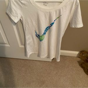 Nike women’s small white tshirt with blue, green and pink Nike logo on front